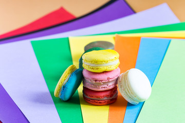 macarons on multicolor background view from above