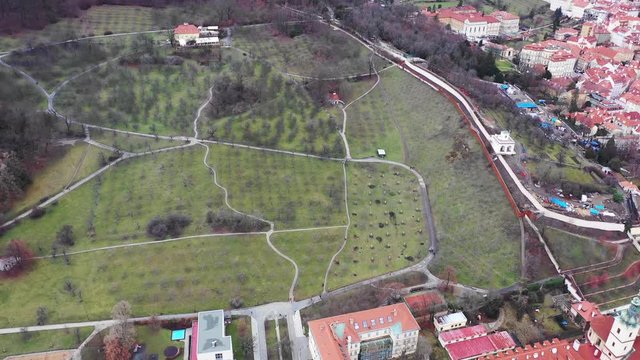 Aerial Prague panorama view of Old Town and Petrin park. Beautiful red roof housing shot by Drone DJI. Daylight Panoramic Aerial Drone View from Above on Prague, Czech Republic.