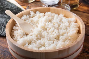 Foto op Plexiglas jaoanese sushi rice in wooden bowl with ingredients © ahirao