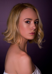 Fototapeta premium Woman modern hair cut, blonde middle length ironed curly, isolated in studio