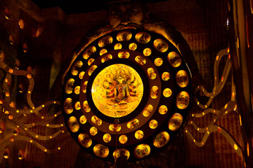 Durga Puja ,Diwali festival or Christmas decoration with warm lights and small idols.