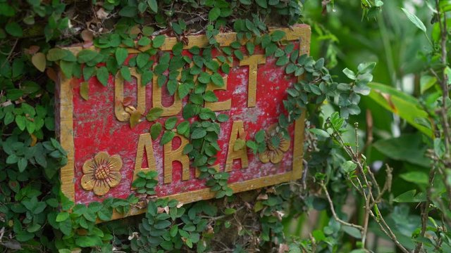 Closeup shot of the Quet area sign in a tropical spa
