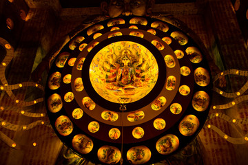 Durga Puja ,Diwali festival or Christmas decoration with warm lights and small idols.