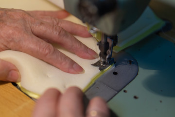 woman sewing on a machine