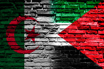 Flag of Algeria and Palestine on brick wall