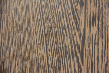 THE BACKGROUND IS STRIPED DARK BROWN