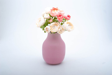 Pink vase with beautiful white and pink flower bouquet on white background