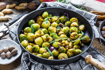 Frying pan with roasted brussel sprouts on table