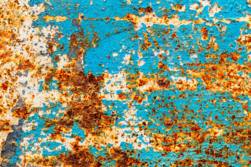 Obraz na płótnie Canvas a sheet of metal was coated with paint then painted a different color. time destroyed the coating appeared rust. tectura.