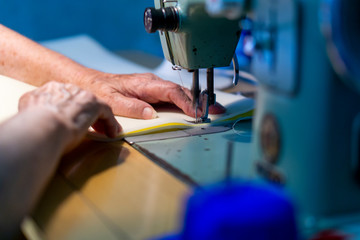 woman working on sewing machine