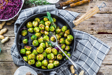 Frying pan with roasted brussel sprouts on table
