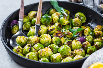 Frying pan with roasted brussel sprouts on table