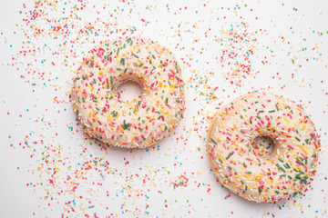 donuts on the background of multi-colored small balls