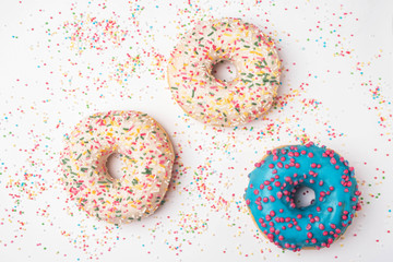 donuts on the background of multi-colored small balls