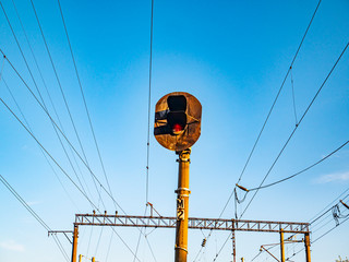Railway traffic light of red color.