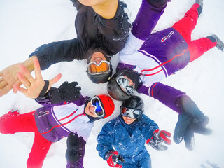 Group Of Middle Aged Couples On Ski Holiday In Mountains