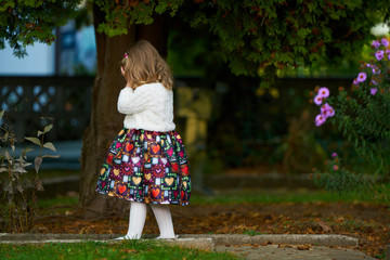 Sad little girl in the park