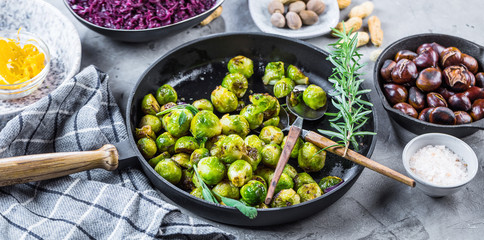 Frying pan with roasted brussel sprouts on table