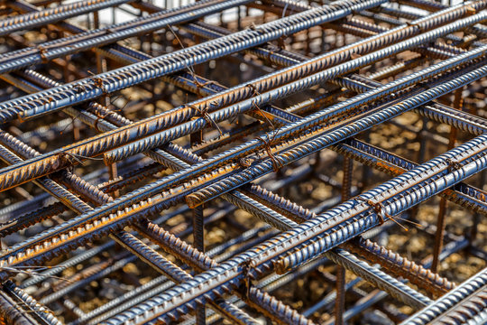 Industrial background. Rebar texture. Rusty rebar for concrete pouring. Steel reinforcement bars. Construction rebar steel work reinforcement. Closeup of Steel rebars.