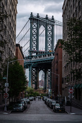 View of one of the towers of the Manhattan Bridge from the streets of the DUMBO district, Brooklyn,...