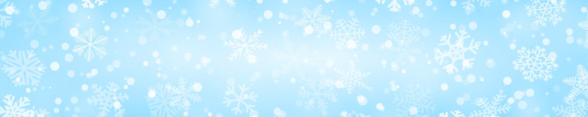 Fototapeta na wymiar Christmas horizontal banner of snowflakes of different shapes, sizes and transparency in light blue colors