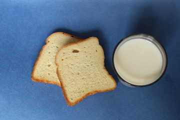 bread and milk on a blue background