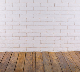 empty interior with wooden floor and decorative white brick wall