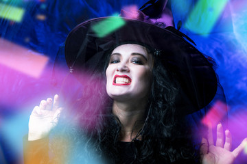 Halloween Witch ,Beautiful young woman in witches hat and costume