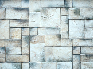 Fototapeta premium Natural stone tiles are beautifully laid out and create a strict geometric pattern.