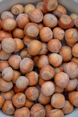 Food background. Hazelnuts texture. Top view . Hazelnut Nut Health Organic Brown Filbert Autumn Background Concept . Hazelnuts. Stack of hazelnuts.