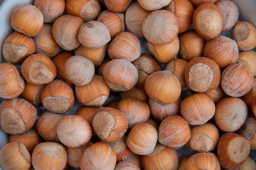 Food background. Hazelnuts texture. Top view . Hazelnut Nut Health Organic Brown Filbert Autumn Background Concept . Hazelnuts. Stack of hazelnuts.