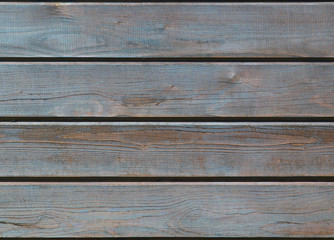 Brown wooden background with detailed wood structure with knots and nail holes. Dark wood texture...