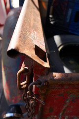 Vintage red pickup tailgate with junk in the truck bed
