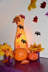 Halloween pumpkin and autumn leaves and home lamp