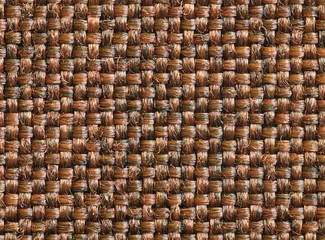 Brown linen texture as background. Bronze fabric backdrop. Cloth shot wallpaper. Bright glossy cloth on pattern. Dark synthetic material upholstery chair 