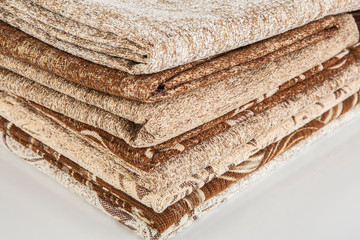 Stacked pile of different and colorful textile materials