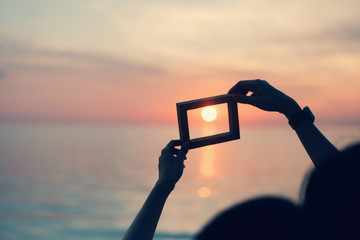 Fototapeta premium Picture frames placed background blurred, natural tones vintage style. Show the world you love Love Family between two people.Let's Stay Together happy mother's day,