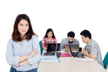 Pretty entrepreneur looks confident with her team