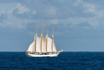 Fototapeta na wymiar Sailing ship with four white sails