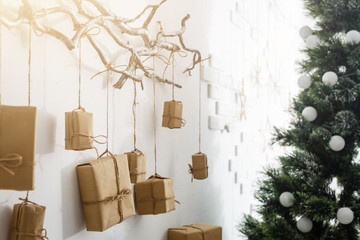 Christmas gift boxes in front of wall with copy space