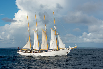 Obraz na płótnie Canvas Sailing ship with four white sails