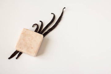 zero waste concept, sustainable lifestyle flat lay. vanilla soap wiht vanila on white background with place for text. top view