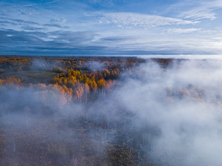 Aerial view of Dreamy foggy autumn landscape