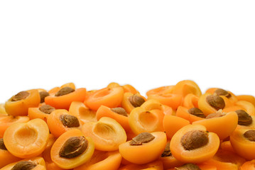 Ripe juicy orange apricots slices isolated on white background. Space for text or design.