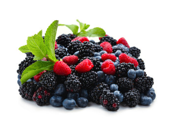 Blackberry, raspberry, blueberry and mint background.