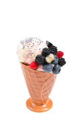 Ice cream with blueberries, blackberries and raspberries on a white background.  Copy space.