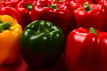 Fresh red, green, yellow bell pepper background.