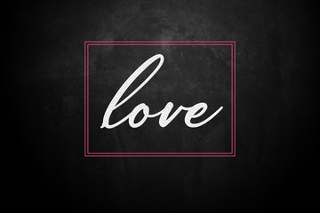 love Word written on blackboard