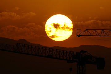 solar disk  sunset crane malaga andalucia spain