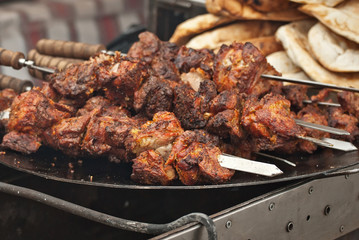 Different types of fried meat on the table. BBQ at the festival.